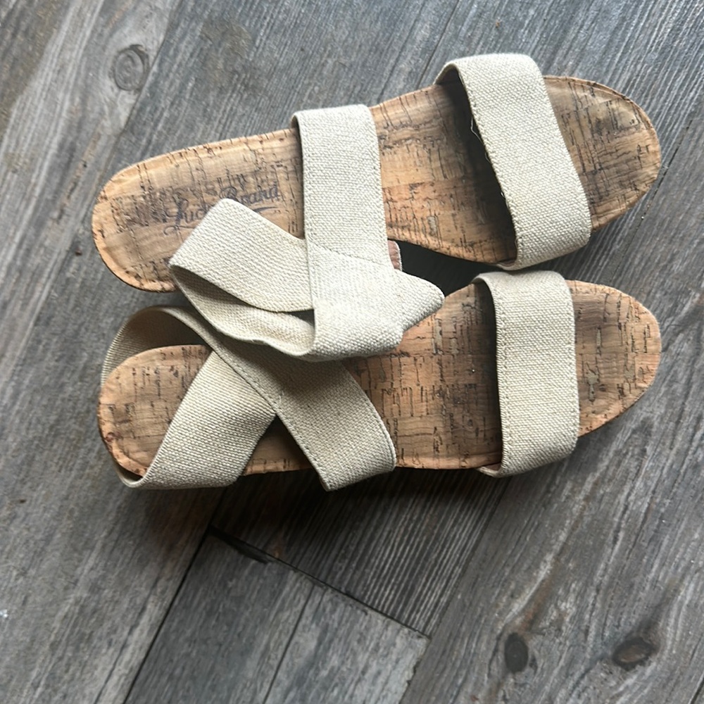 M.  L=
Lucky Brand, size 7.5
Tan canvas straps, cork heel mule
